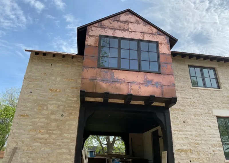 Copper metal panel facade on a stone building for Metal Roof Coating in Marion